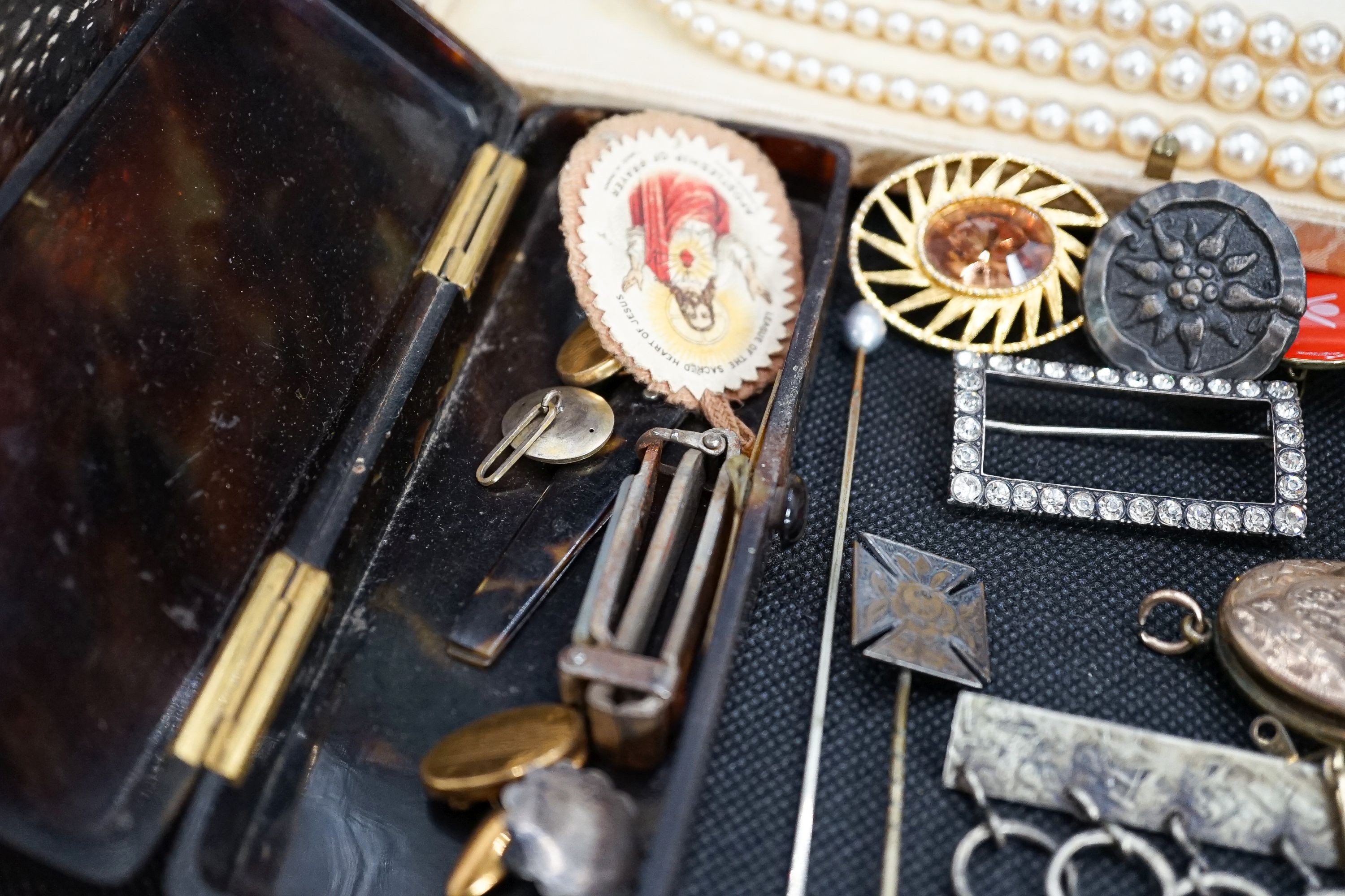 A group of costume jewellery to include a Hermes travelling timepiece.